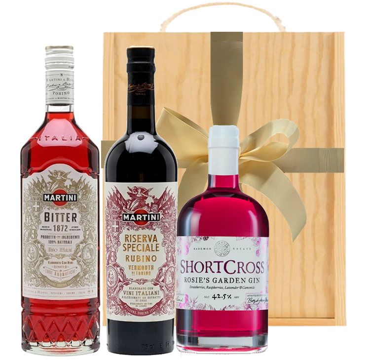 Negroni gift set: raspberry and strawberry gin, Martini Rubino and Martini Bitter beside a triple wooden presentation box