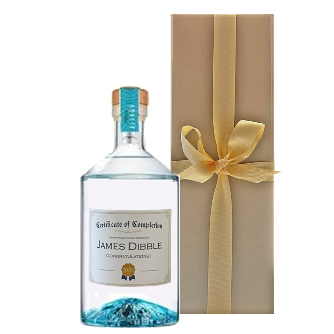 Personalised Volcán Blanco Tequila bottle with a name and message label, presented in a luxury gold gift box
