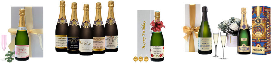 A selection of personalised Champagne bottles in gift boxes with ribbons, flutes and flowers