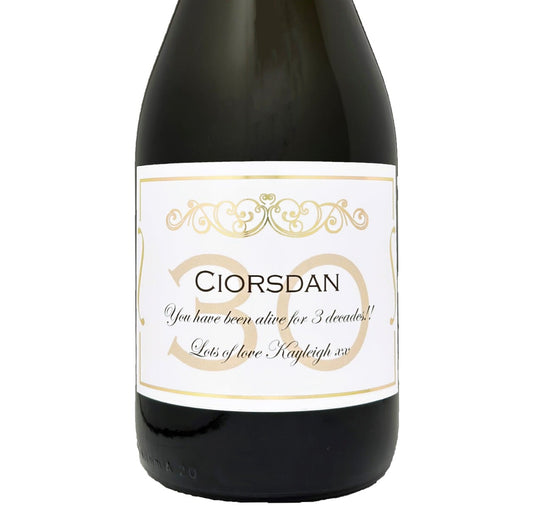 Bottle of Prosecco with a personalised 30th birthday label in gold, showing a name and Happy 30th Birthday message