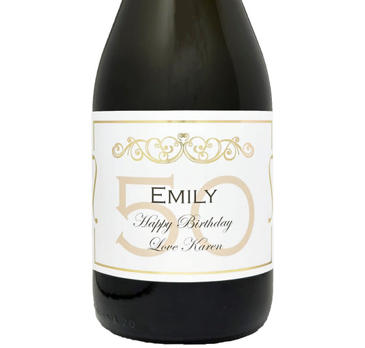 Bottle of Prosecco with a personalised 50th birthday label in gold, showing a name and Happy 50th Birthday message