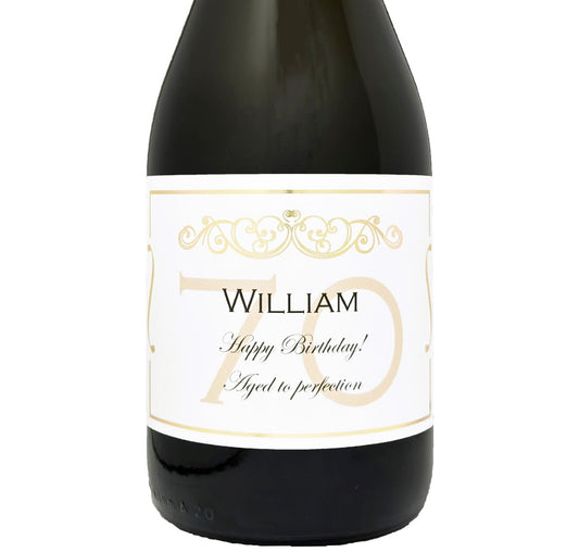 Bottle of Prosecco with a personalised 70th birthday label in gold, showing a name and Happy 70th Birthday message