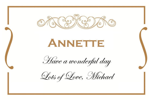 Elegant white and gold personalised birthday Champagne label with a gilded scroll, name and script message