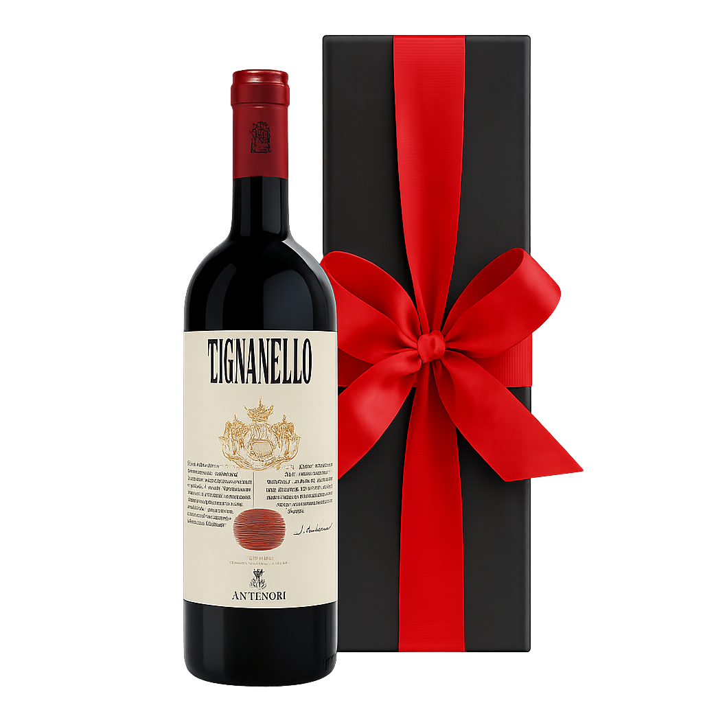 Red wine bottle beside a tall black gift box finished with a red ribbon