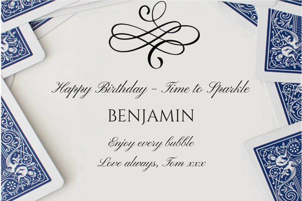 Birthday Champagne label for card lovers: blue playing cards, a black flourish and 'Happy Birthday – Time to Sparkle'