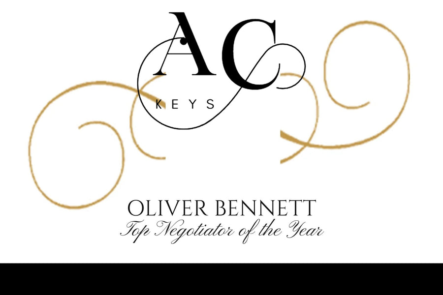Corporate Champagne label branded with your logo in elegant gold swirls, a name and strap line on crisp white