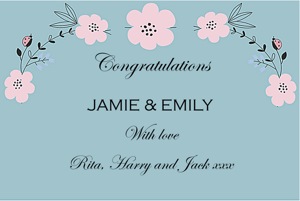 Congratulations Champagne label in powder blue scattered with pink blossom, names and a warm script message