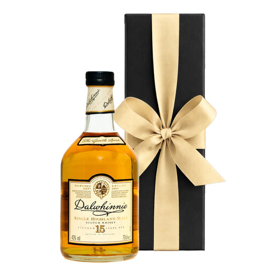Personalised Dalwhinnie 15 Year Old single malt whisky with a custom label beside a luxury black presentation box