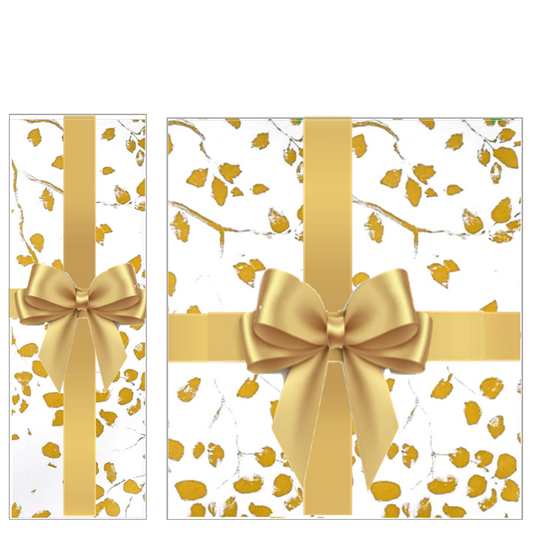 Bottle and gift box hand-wrapped in white paper with gold leaves and a gold satin ribbon bow