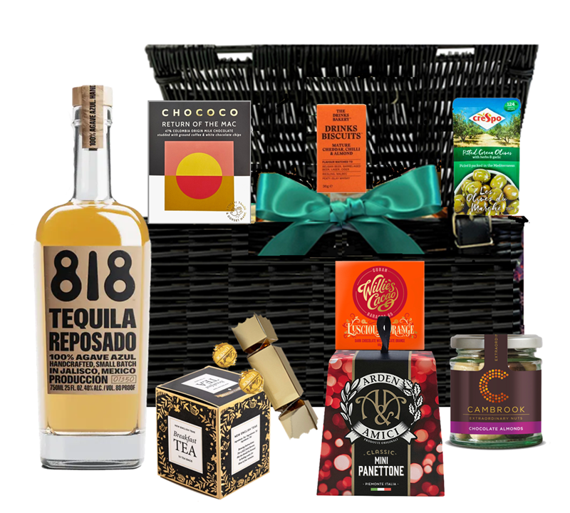 Lidded wicker Christmas hamper with a bottle of 818 Reposado Añejo tequila and festive treats, tied with ribbon