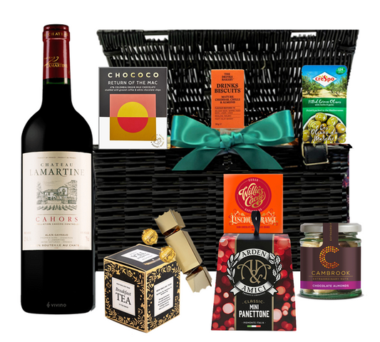 Lidded wicker Christmas hamper with a personalised bottle of Cahors red wine and festive treats, tied with ribbon