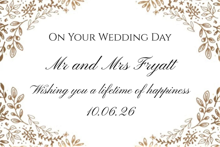 Personalised wedding Champagne label with gilded leaves framing 'On Your Wedding Day', the couple's names and date