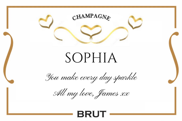 Champagne Brut label with gold ribbon hearts, gold frame, name and script message