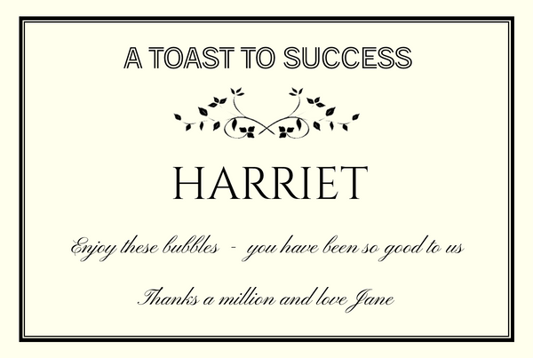'A Toast to Success' Champagne label in cream with a black frame, a name and a message of thanks