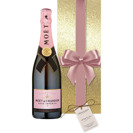 Moët Rosé Impérial Champagne gift-wrapped in Classic Gold wrap with a large hand-tied bow and A Little Luxury gift tag