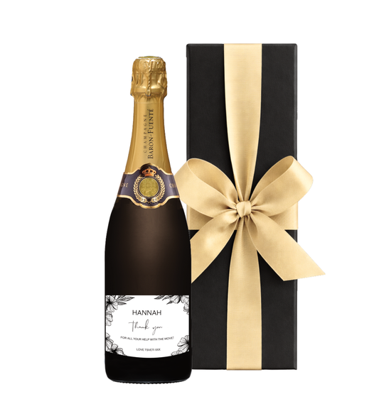 Smart personalised Champagne gift with gold label, presented in a sleek black presentation box — ideal for corporate and celebration gifting