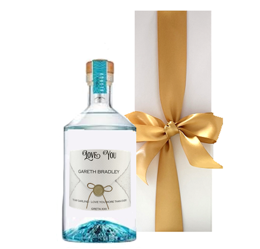 Personalised Volcán Blanco Tequila bottle with a name and message label, presented in a luxury white gift box
