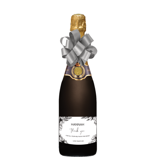 Award-winning personalised Champagne with an elegant black and white floral Thank You label showing name and message — a beautifully detailed gift