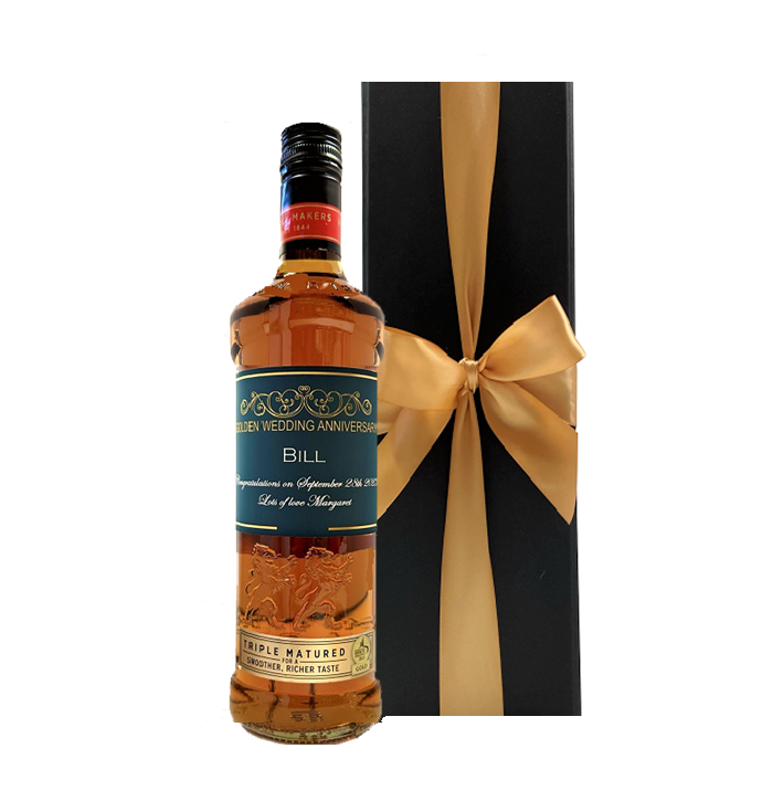 Personalised triple matured blended Scotch whisky with a custom label beside a luxury black gift box with a bow