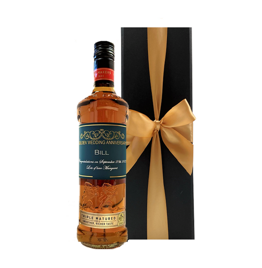 Personalised triple matured blended Scotch whisky with a custom label beside a luxury black gift box with a bow