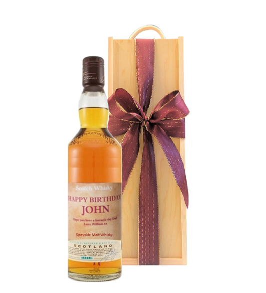 Personalised Speyside single malt whisky with a name label beside a luxury wooden presentation box tied with a bow