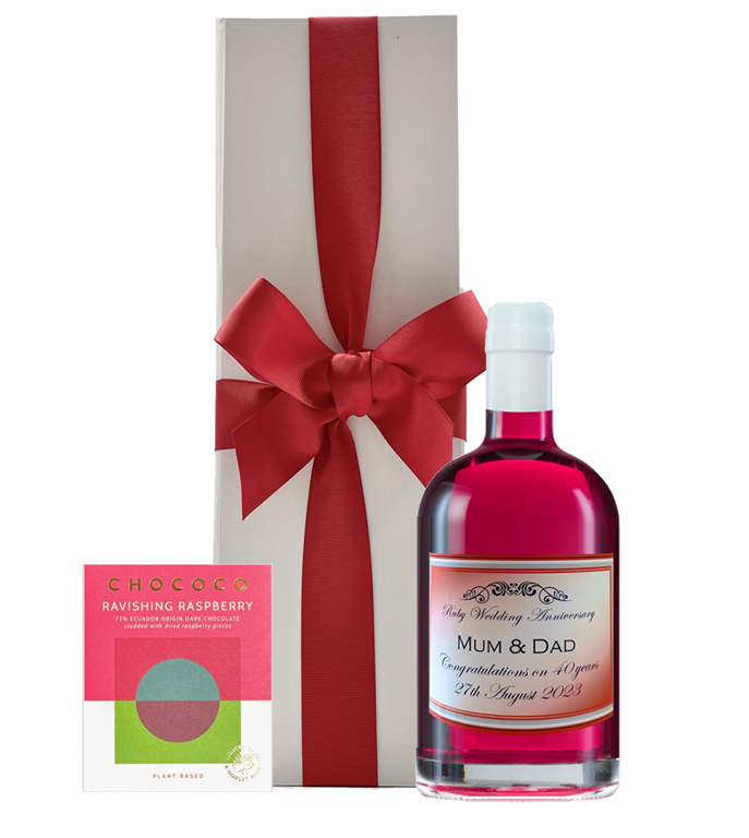 Pink raspberry and strawberry gin beside a white gift box with a bow and a Ravishing Raspberry dark chocolate bar