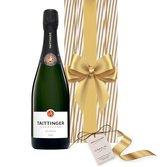 Taittinger Brut Réserve Champagne hand gift-wrapped in Classic Gold Stripe wrap with an A Little Luxury gift tag