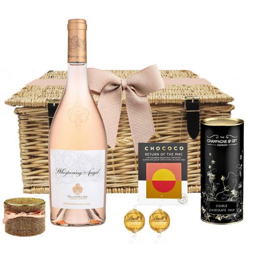Whispering Wishes hamper with Whispering Angel rosé, chocolate, candle and biscuits in a wicker basket