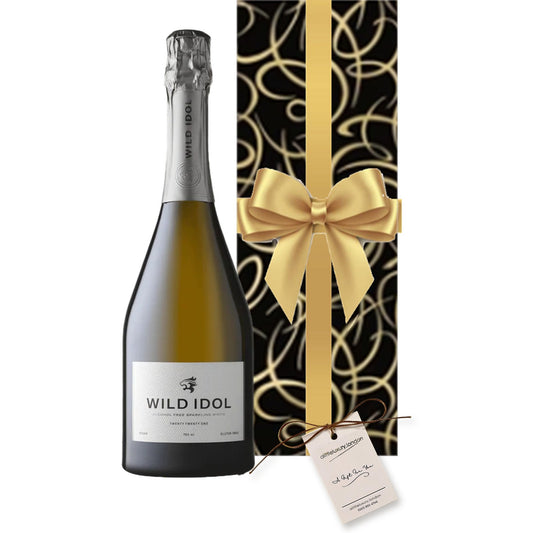 Wild Idol Alcohol-Free Sparkling hand gift-wrapped in Smart Black & Gold Swirl wrap with an A Little Luxury gift tag